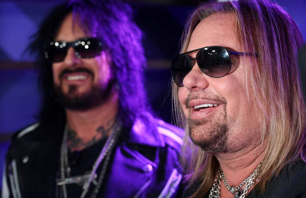 Nikki Sixx, left, and Vince Neil of Motley Crue are interviewed following a news conference to ...