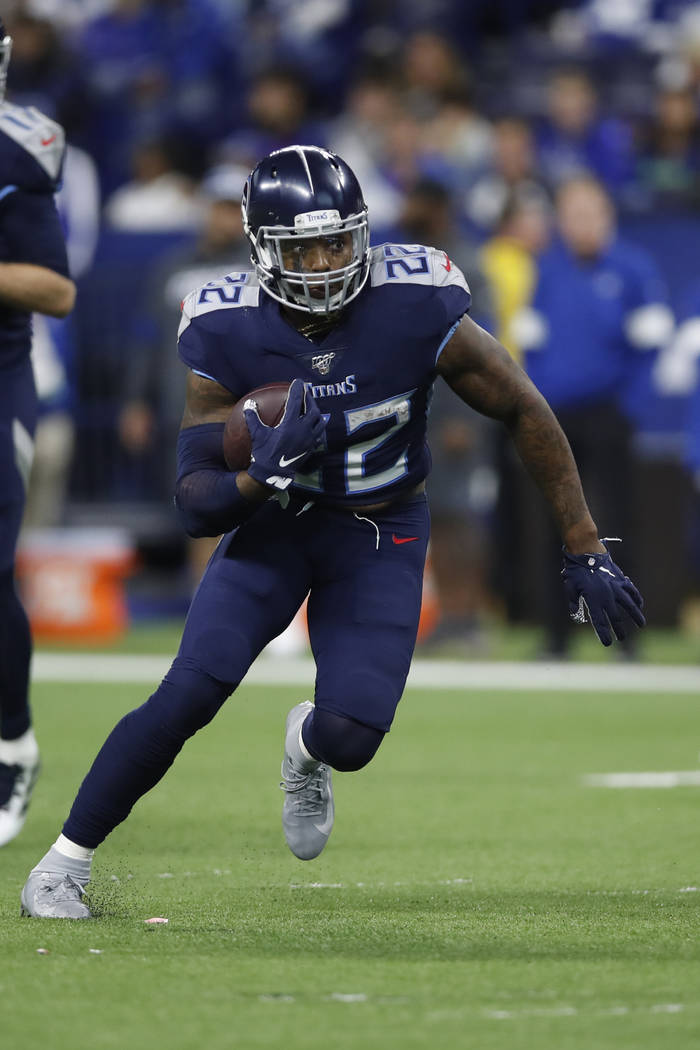 Tennessee Titans running back Derrick Henry (22) runs the ball against the Indianapolis Colts d ...