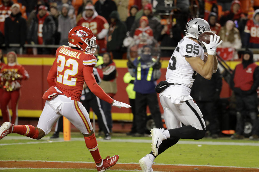 Oakland Raiders tight end Derek Carrier (85) makes a touchdown catch in front of Kansas City Ch ...