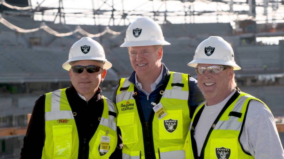 Raiders team president Marc Badain, NFL commissioner Roger Goodell and Raiders owner Mark Davis ...