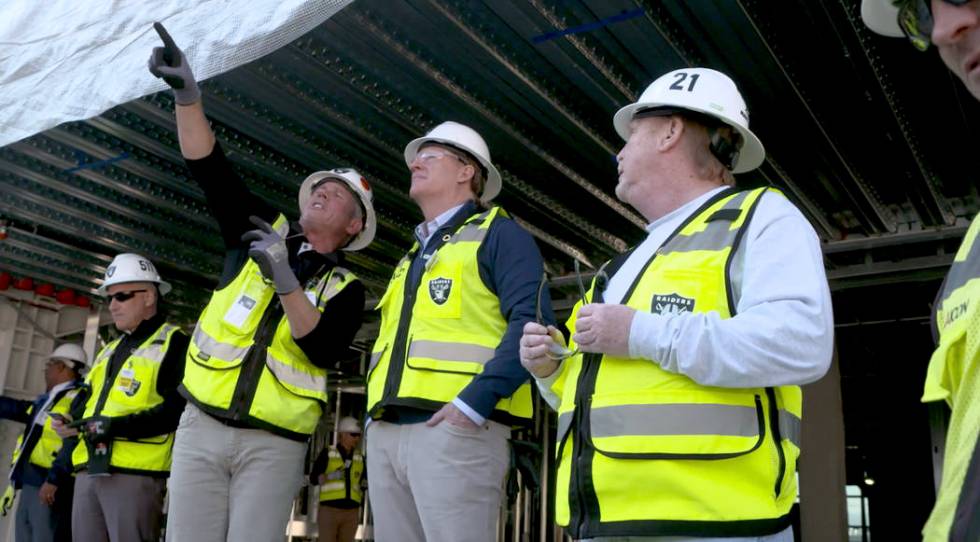 NFL commissioner Roger Goodell, center, gets a tour of Allegiant Stadium on Thursday, Dec. 5, 2 ...