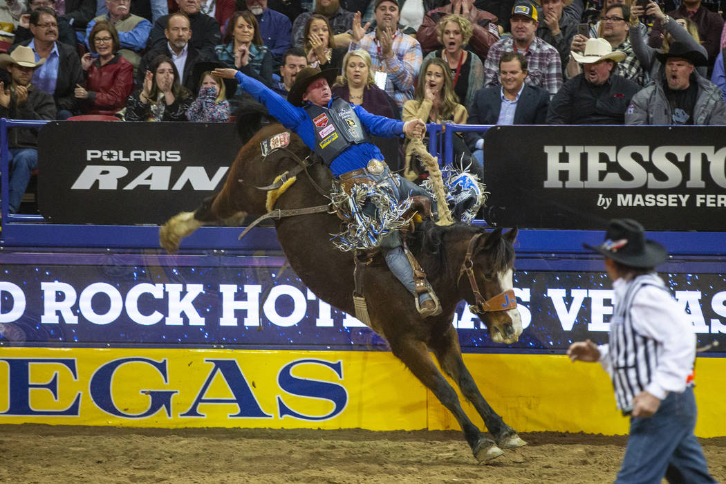 Spencer Wright of Milford, Utah, rides Hell on Hooves in Saddle Bronc Riding during the third g ...