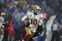 San Francisco quarterback Jimmy Garoppolo runs the ball against the Baltimore Ravens in the fir ...