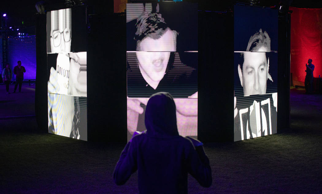 Luke Yeager, 15, of Las Vegas, views the "I Am Therefore I Am" art installation at In ...