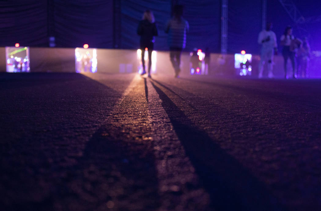 Festival-goers leave the main stage at Intersect Festival on Friday, Dec. 6, 2019, in Las Vegas ...