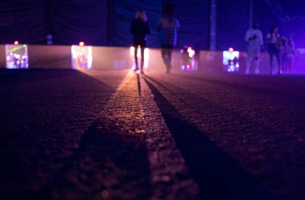 Festival-goers leave the main stage at Intersect Festival on Friday, Dec. 6, 2019, in Las Vegas ...