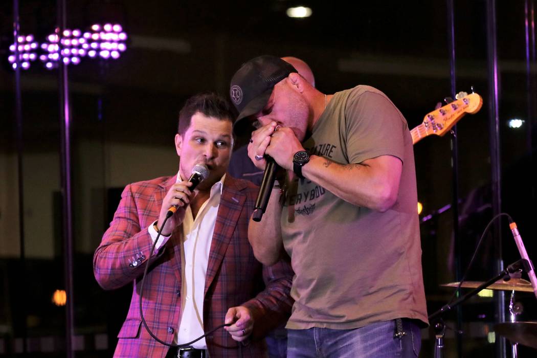 Mondays Dark founder Mark Shunock and UFC legend Randy Couture perform "A Hard Day's Night" at ...