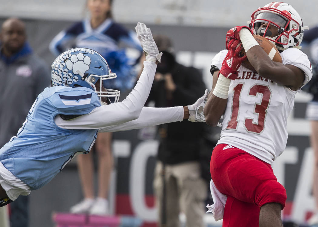 Liberty junior wide receiver Corey Hebert (13) beats Centennial junior cornerback Tyrone McCoy ...