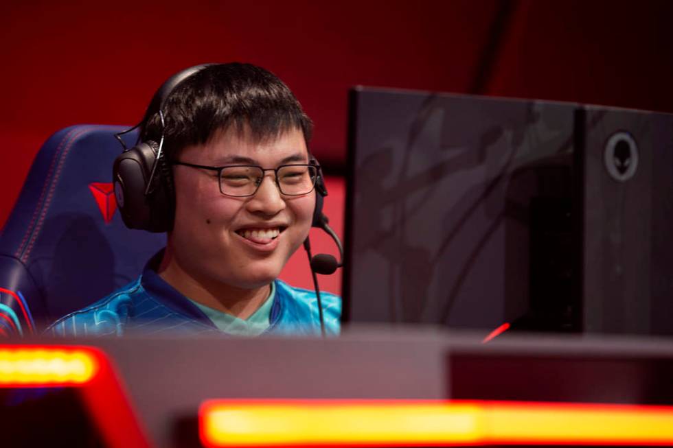 Jian Zihao, who plays League of Legends professionally under the name "Uzi," smiles a ...