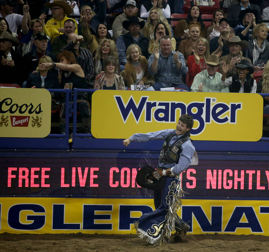 Trenten Montero of Winnemucca celebrates after riding Prairie Rose in Bareback Riding during th ...