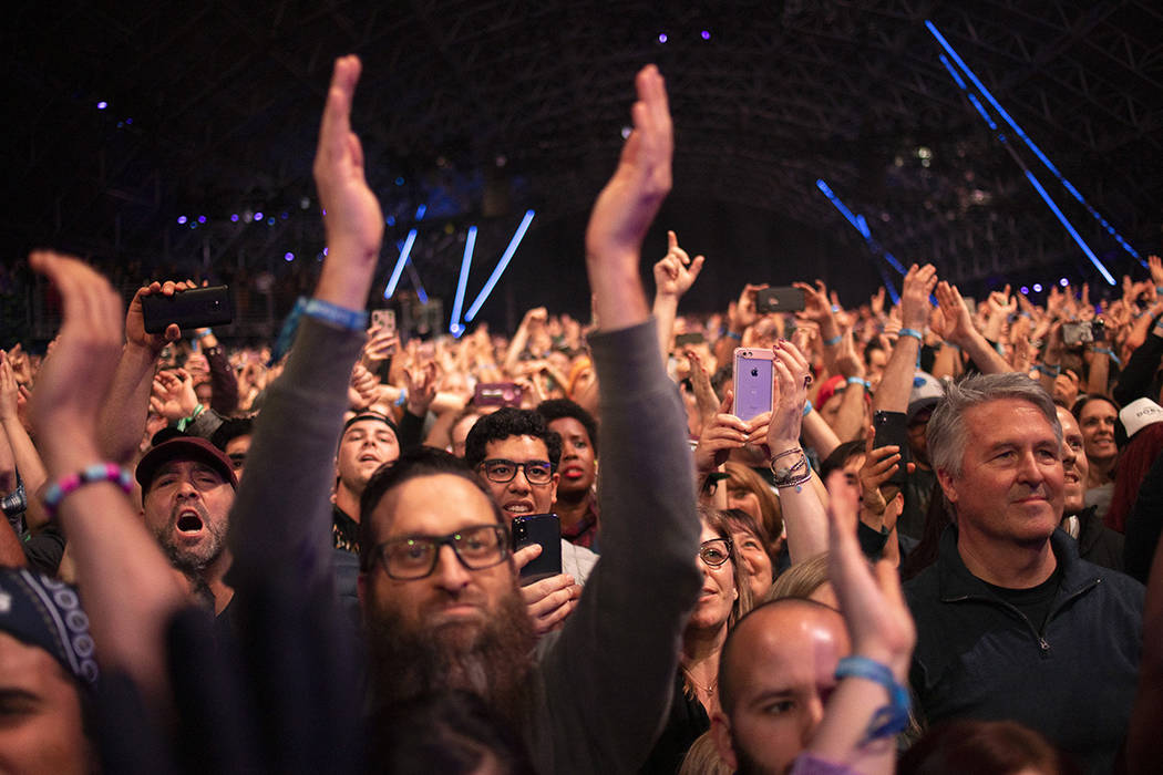 The crowd at Foo Fighters raises their hands for the band on Saturday, Dec. 7, 2019, at Interse ...