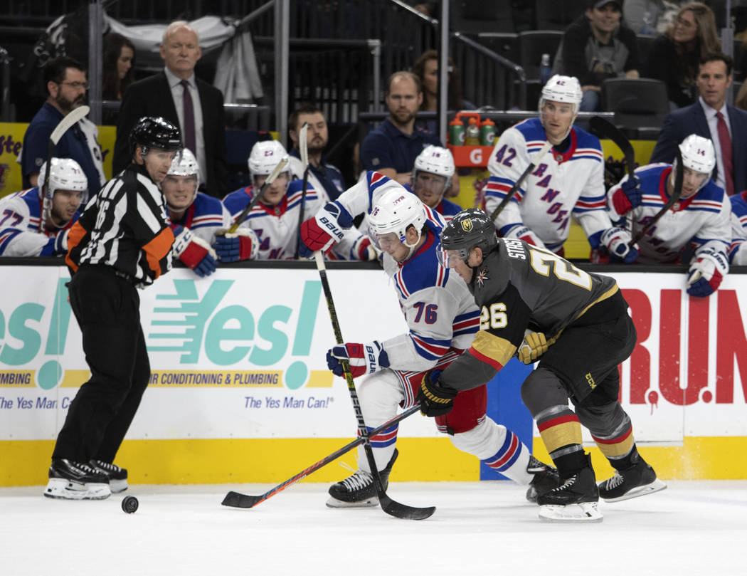 New York Rangers defenseman Brady Skjei (76) and Vegas Golden Knights center Paul Stastny (26) ...