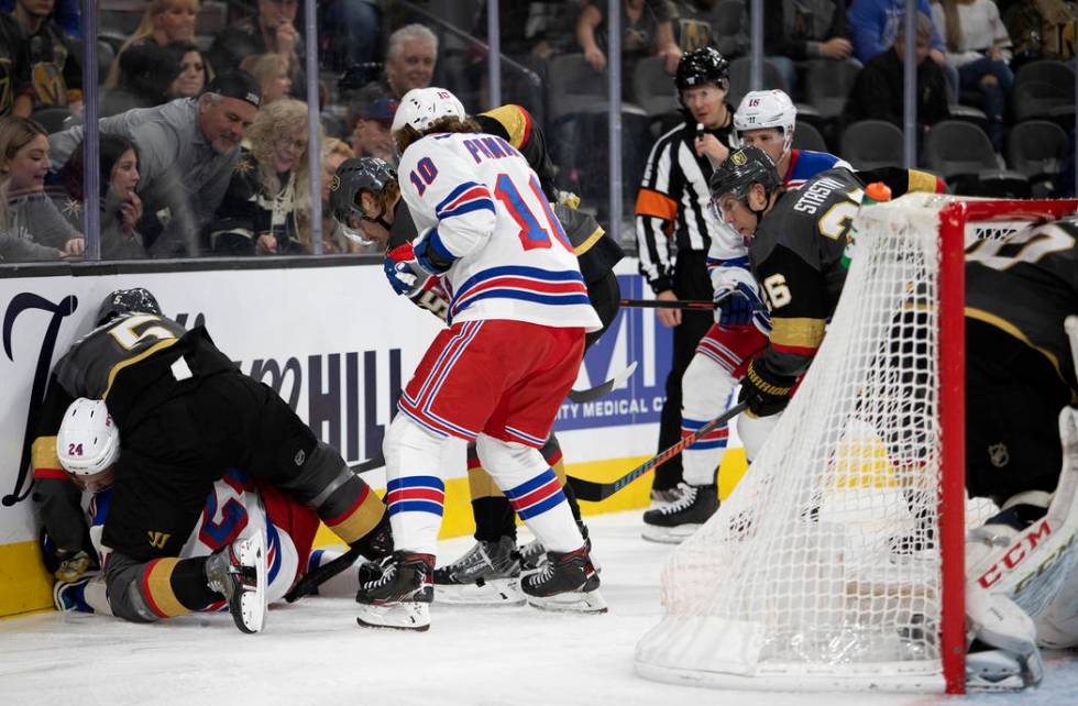 Vegas Golden Knights defenseman Deryk Engelland (5) fights New York Rangers right wing Kaapo Ka ...