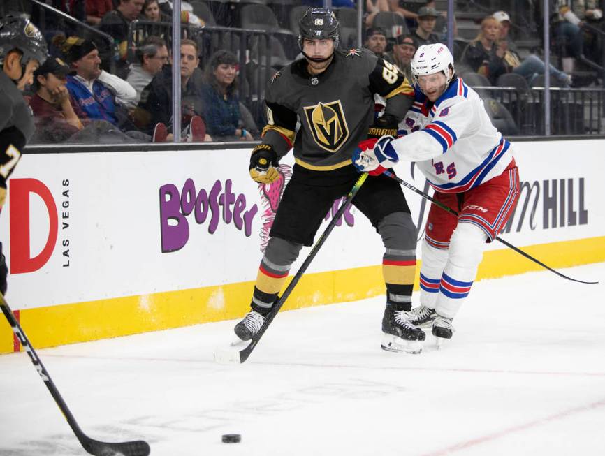 Golden Knights right wing Alex Tuch (89) eyes the puck after passing as New York Rangers defens ...