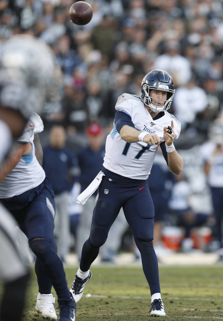 Tennessee Titans quarterback Ryan Tannehill (17) passes against the Oakland Raiders during the ...