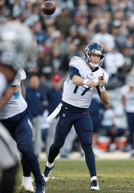 Tennessee Titans quarterback Ryan Tannehill (17) passes against the Oakland Raiders during the ...