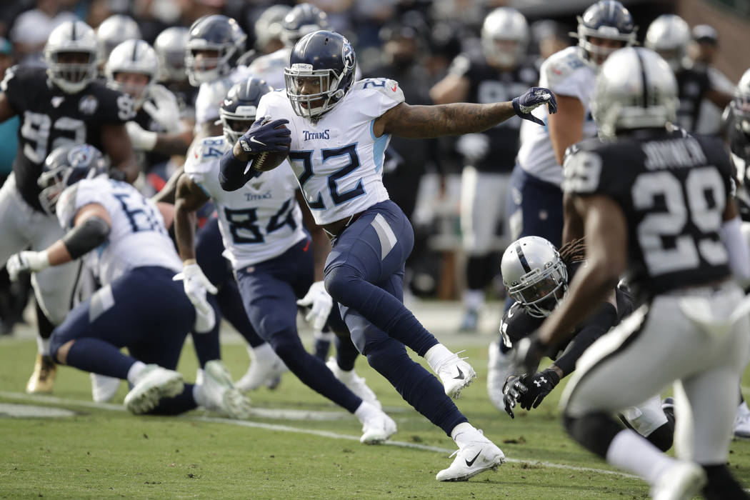 Tennessee Titans running back Derrick Henry (22) runs against the Oakland Raiders during the fi ...