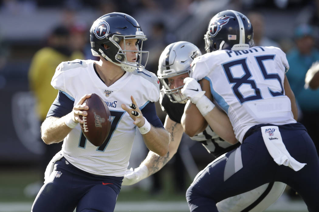 Tennessee Titans quarterback Ryan Tannehill (17) passes against the Oakland Raiders during the ...