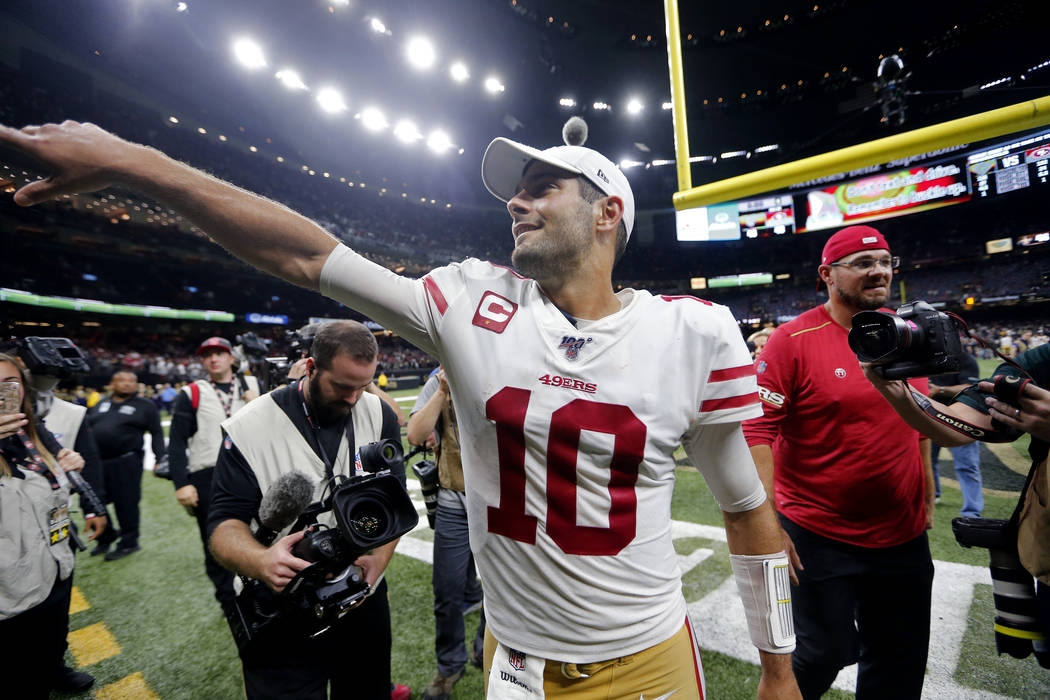 San Francisco 49ers quarterback Jimmy Garoppolo (10) celebrates after an NFL football game agai ...