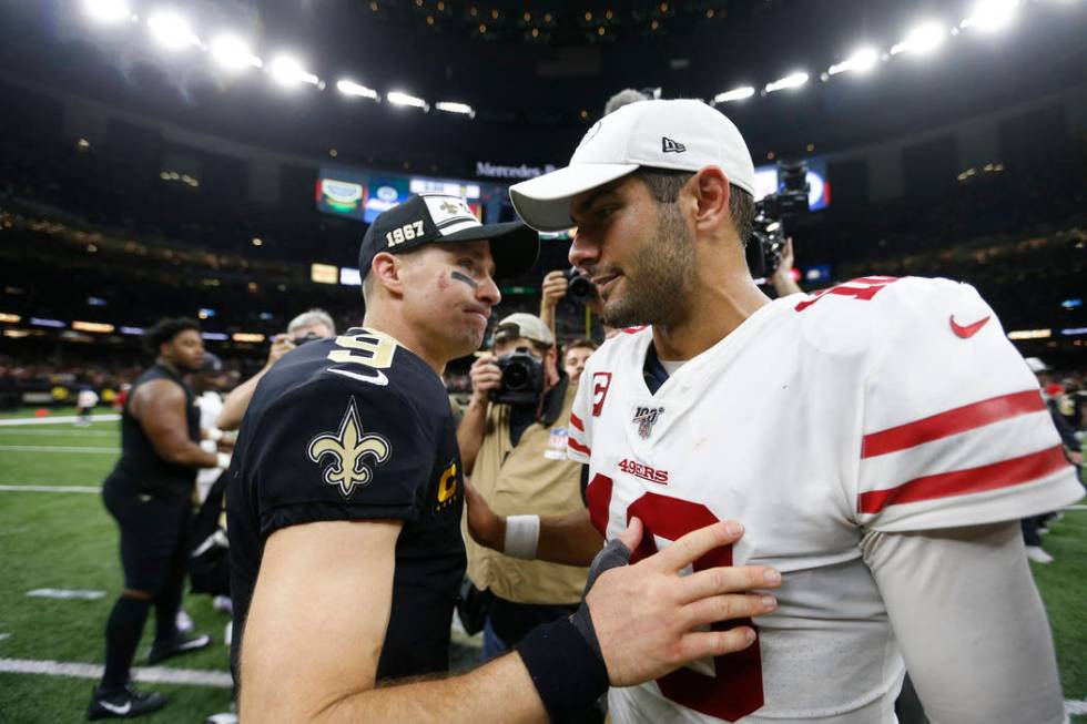 New Orleans Saints quarterback Drew Brees (9) greets San Francisco 49ers quarterback Jimmy Garo ...