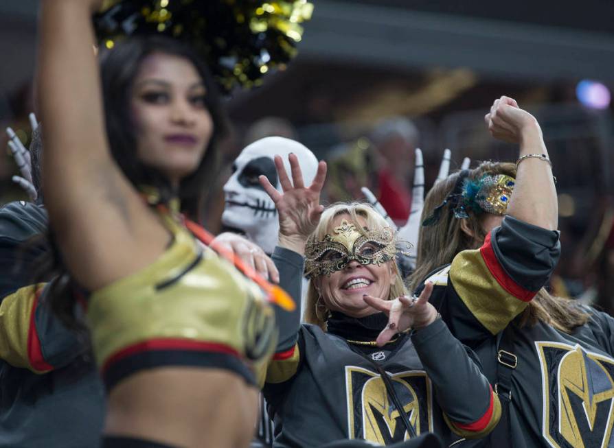Vegas fans dress up for Halloween at T-Mobile Arena during the Golden Knights NHL hockey game w ...