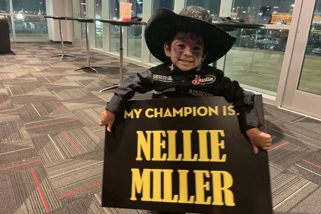 Aryia Ramos shows who she's rooting for -- star barrel racer Nellie Miller -- before Sunday nig ...