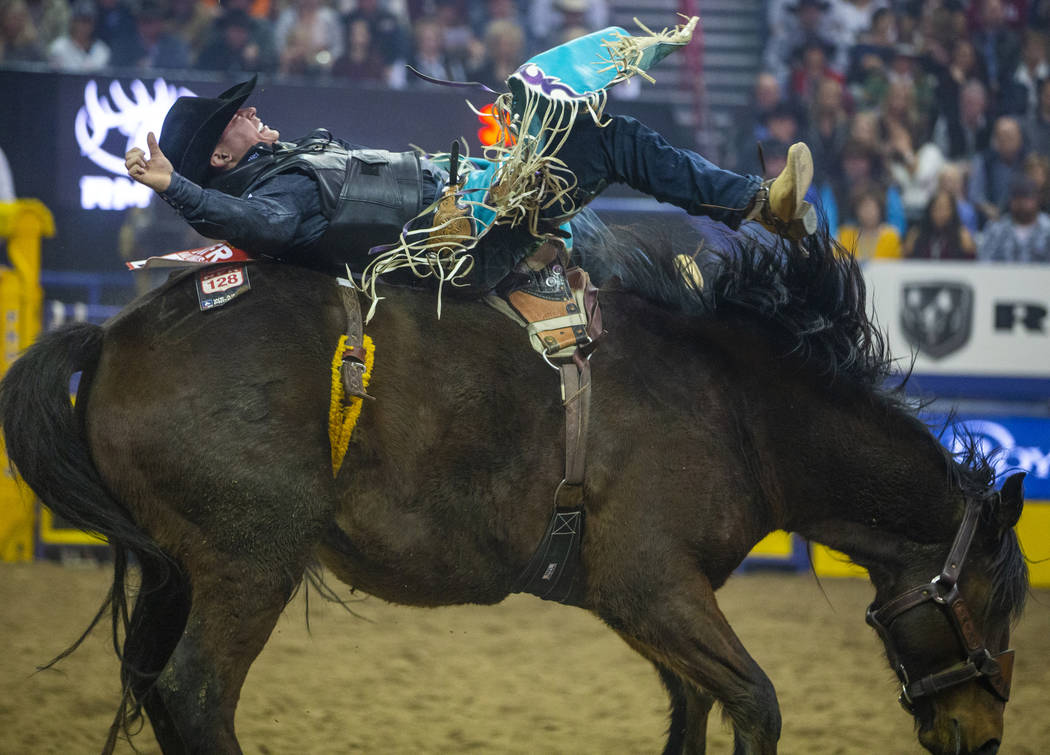 Tanner Aus of Granite Falls, Minn., rides Full Baggage to a first place score of 90 in Bareback ...
