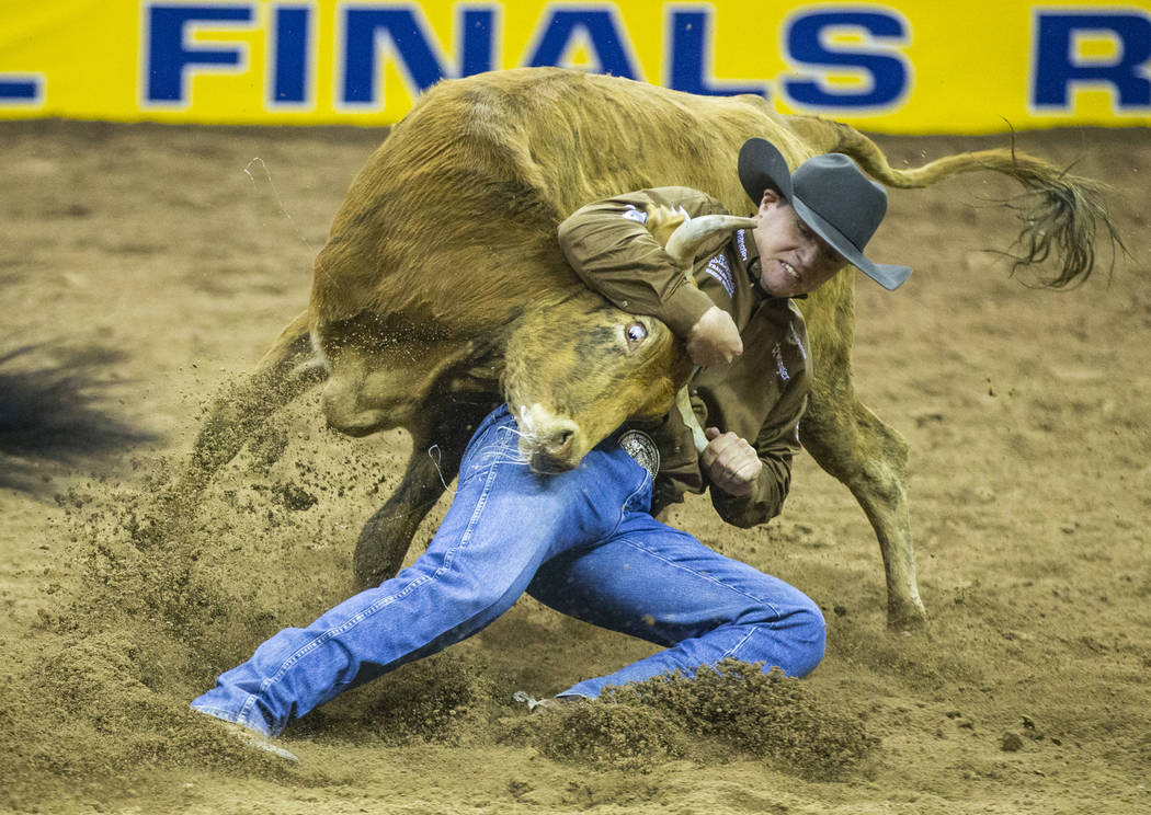 J.D. Struxness of Milan, Minn., places in Steer Wrestling during the third go-around of the Wra ...