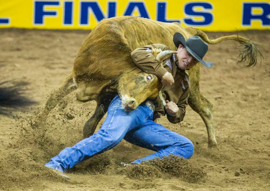 J.D. Struxness of Milan, Minn., places in Steer Wrestling during the third go-around of the Wra ...