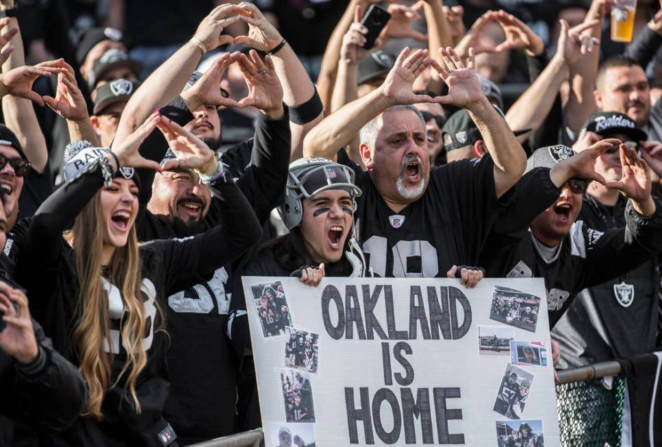 Raiders fans cheer for Oakland during an NFL football game with the Jacksonville Jaguars at the ...