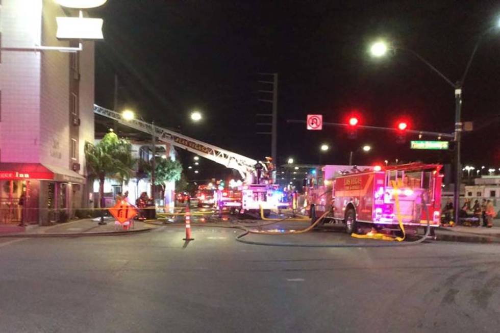 Firefighters battle a two-alarm blaze in a vacant building at 307 S. Main St. early Monday, Dec ...