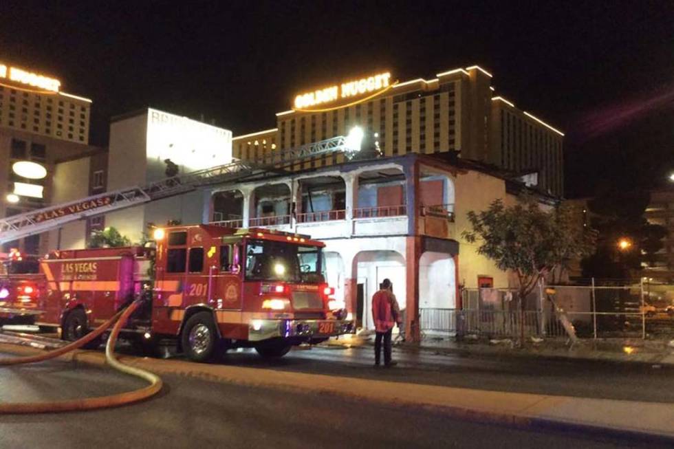 Firefighters battle a two-alarm blaze in a vacant building at 307 S. Main St. early Monday, Dec ...