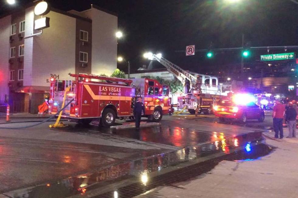 Firefighters battle a two-alarm blaze in a vacant building at 307 S. Main St. early Monday, Dec ...