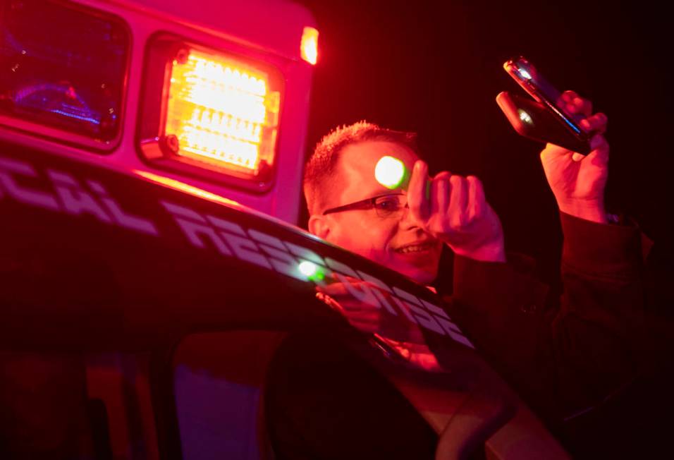 MedicWest operations manager Nick Jurman shines three flashlights up to the third floor of UMC ...