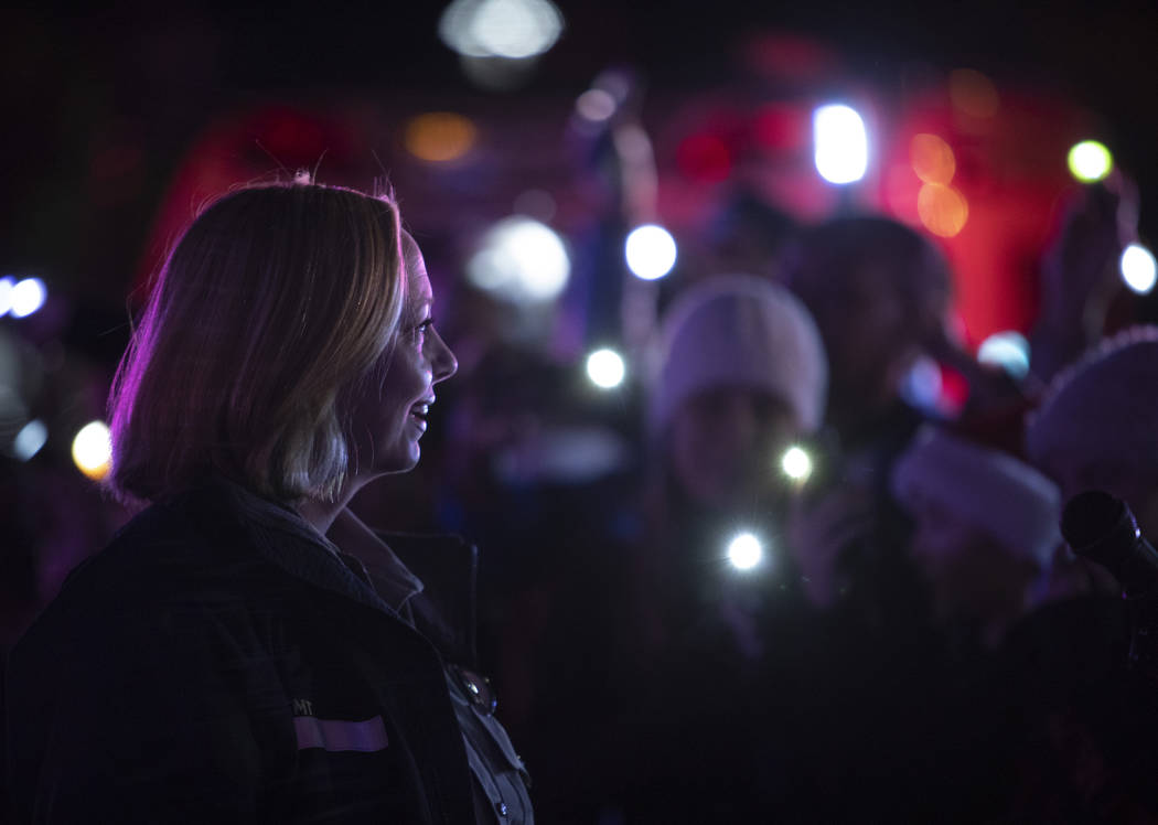 MedicWest paramedic Heather Raasveld, who organized the event, leads the crowd in moving their ...