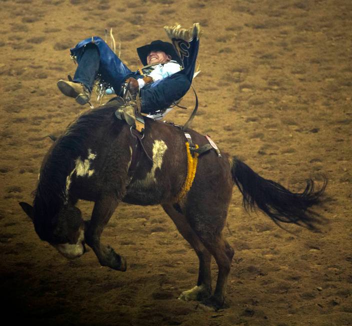 Trenten Montero of Winnemucca, Nev., rides Show Boat during Bareback Riding in the fourth go ro ...