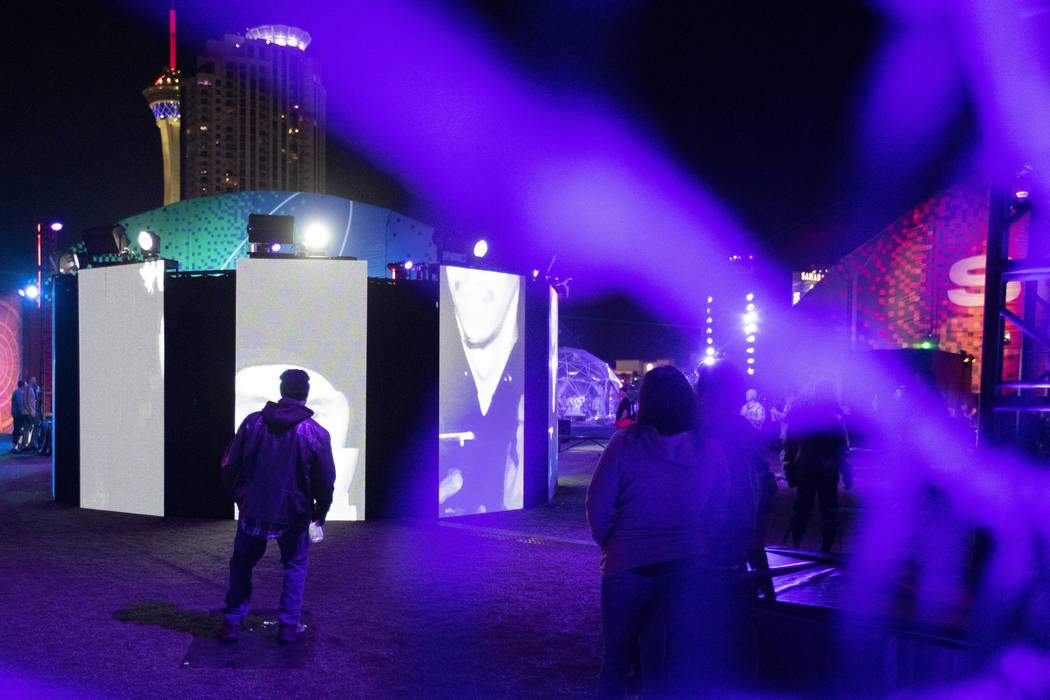 Festival attendees interact with "Mixed Mirrors," an art installation at Intersect Fe ...