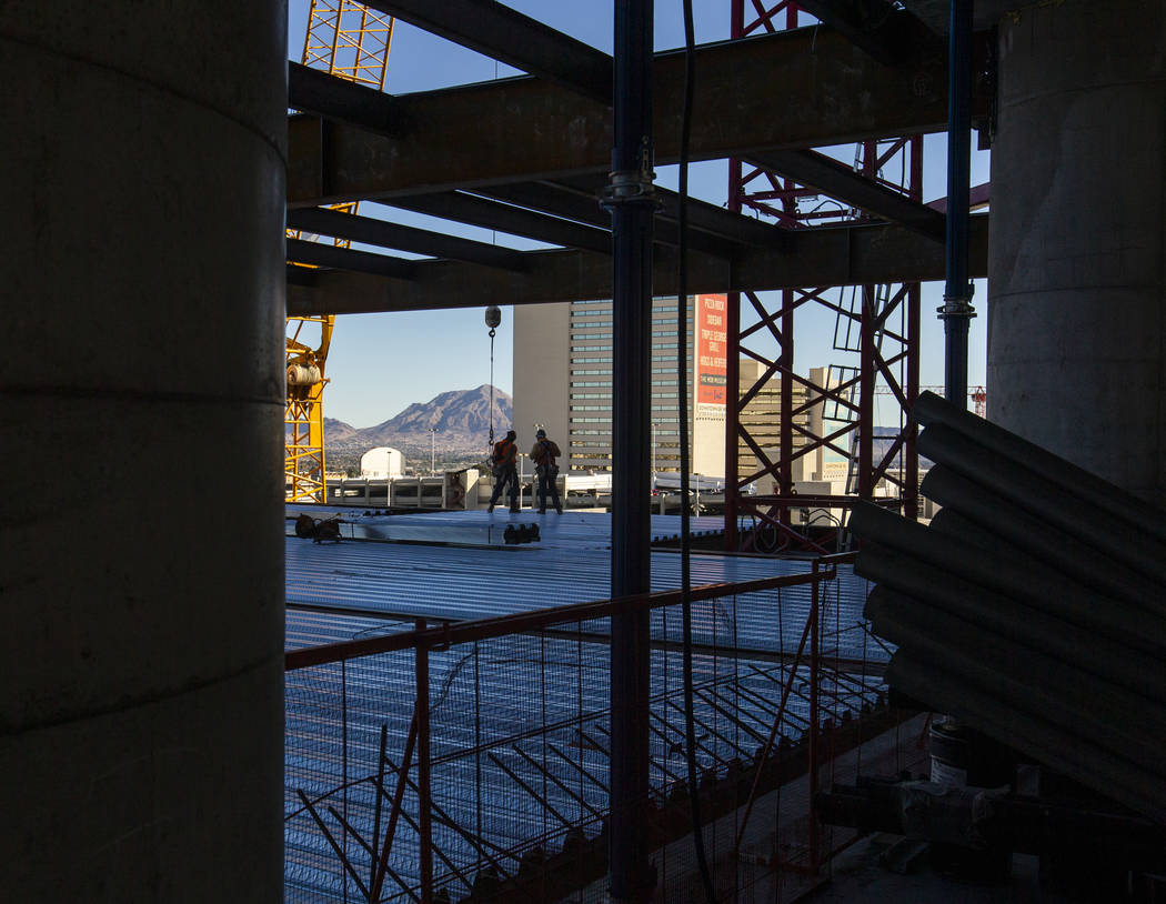 Workers ready for another beam to be brought up during a construction tour of the Circa on Mond ...