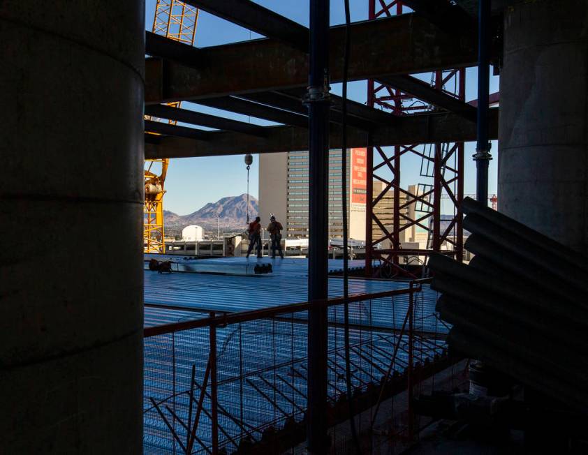 Workers ready for another beam to be brought up during a construction tour of the Circa on Mond ...