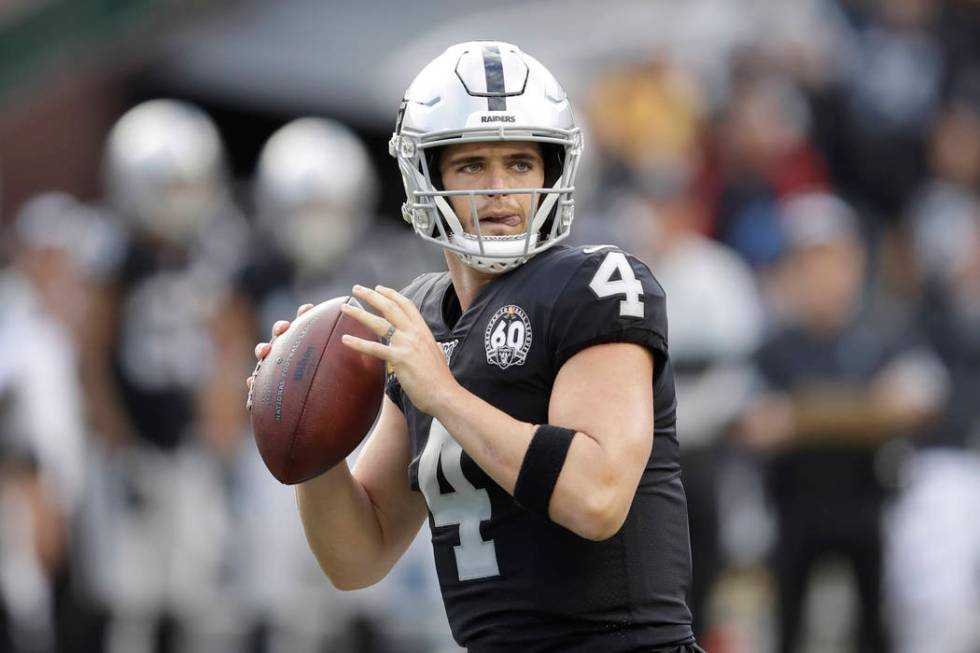 Oakland Raiders quarterback Derek Carr (4) passes against the Tennessee Titans during the first ...