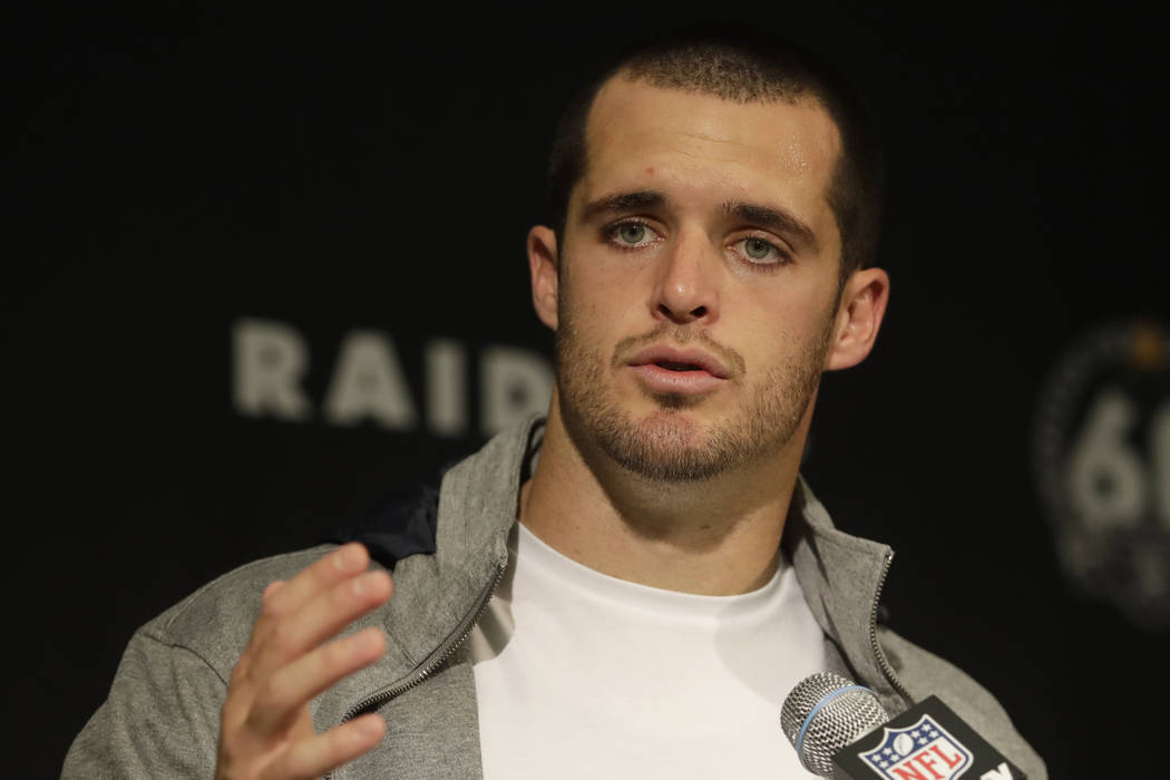 Oakland Raiders quarterback Derek Carr speaks at a news conference after an NFL football game a ...