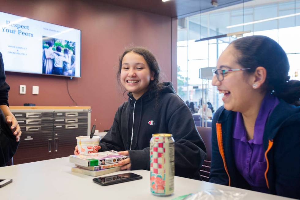 Martin Middle School students Nicole Valenzuela, 12, left, and Aranca Medina, 12, hangout in th ...