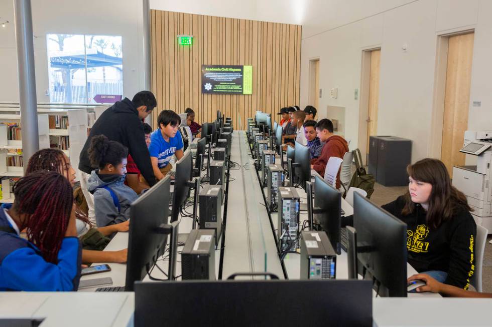 Youth do different actives in the computer lab at the East Las Vegas Library in Las Vegas on Tu ...