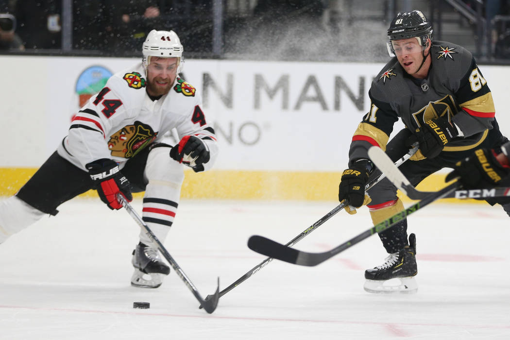 Chicago Blackhawks defenseman Calvin de Haan (44) and Vegas Golden Knights center Jonathan Marc ...