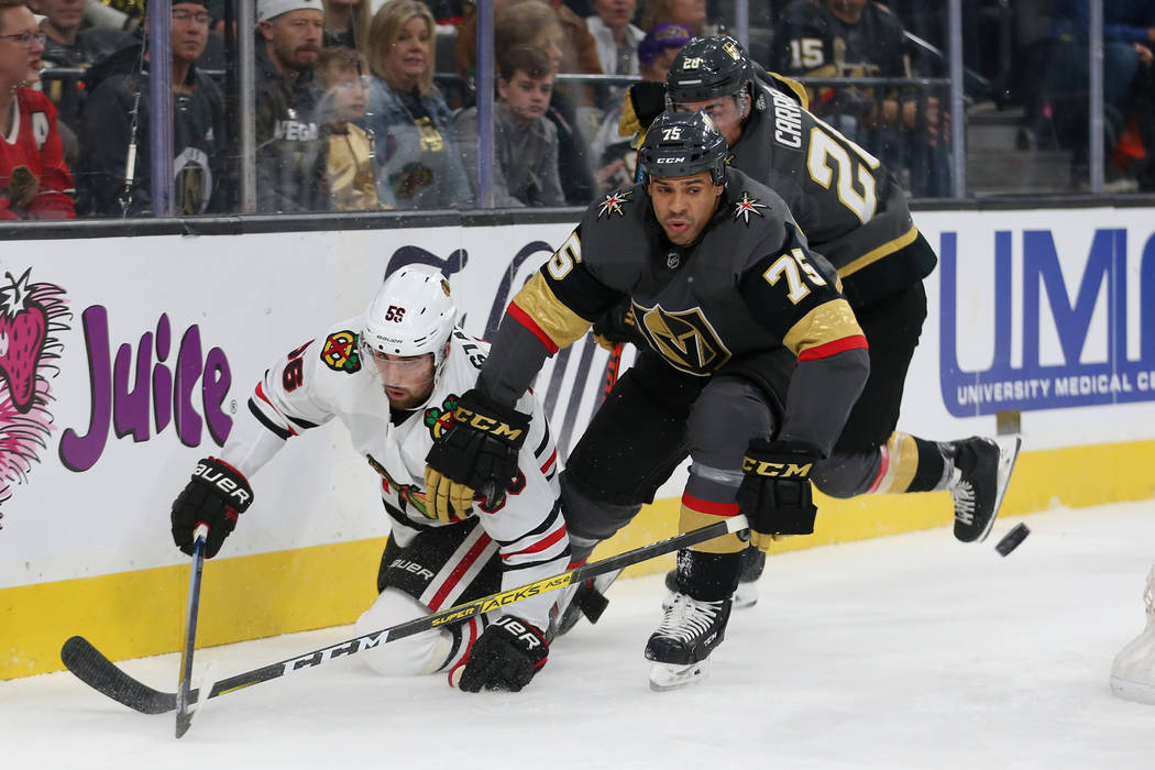 Vegas Golden Knights right wing Ryan Reaves (75) and Chicago Blackhawks defenseman Erik Gustafs ...