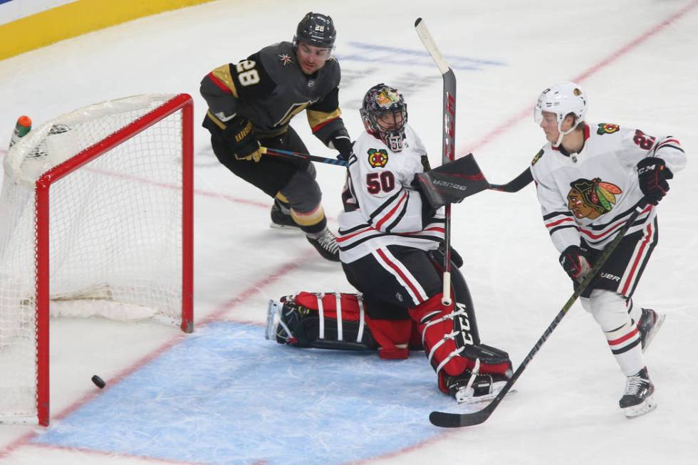 Vegas Golden Knights left wing William Carrier (28) looks on as a shot byright wing Ryan Reaves ...