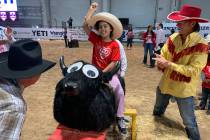 Tiana Turner keeps her right arm up in displaying perfect form while riding the rocking bull du ...