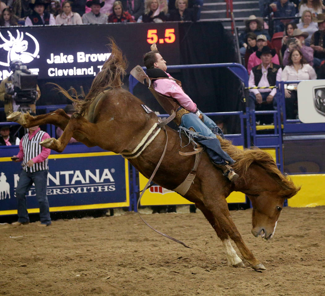 Jake Brown of Cleveland, Texas rides Good time Charlie during Bareback Riding in the fifth go-a ...