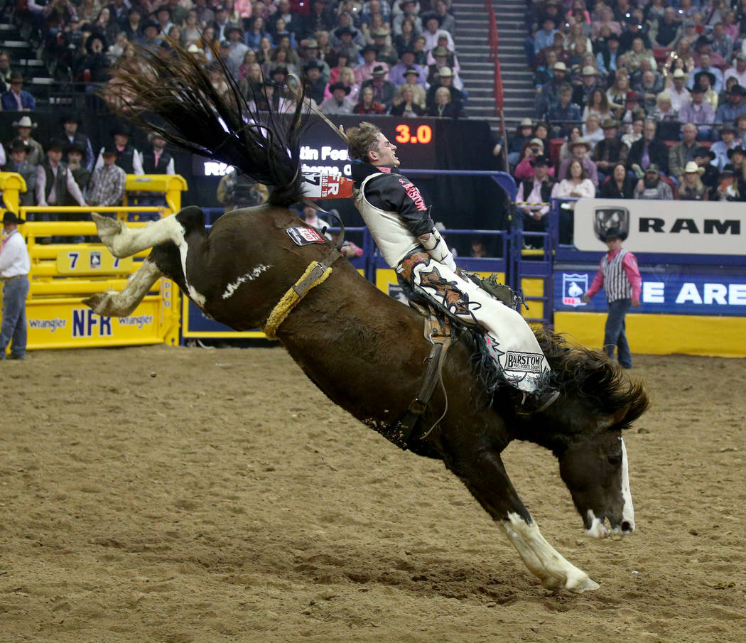 Austin Foss of Terrebonne, Ore. rides Blessed Assurance during Bareback Riding in the fifth go- ...