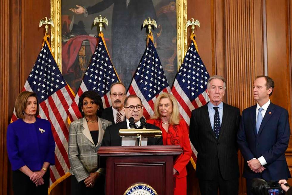 Members of the U.S. House of Representatives unveil articles of impeachment against President D ...